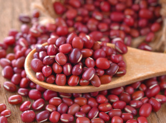 Red bean in a wooden spoon on a table