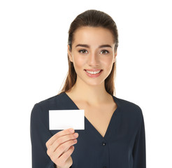 Beautiful young woman with business card on white background