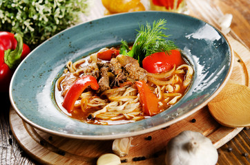Noodles with mutton and vegetables. Central Asian cuisine. Lagman