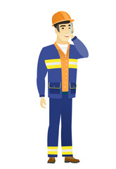 Builder talking on a mobile phone.