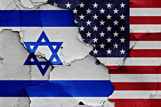 flags of Israel and USA painted on cracked wall