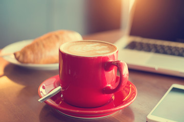 latte with laptop and vintage tone