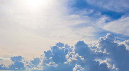 Cloudy sky with sunny flare. Rainy clouds banner. Natural photo scene with cloud cumulus above horizon.