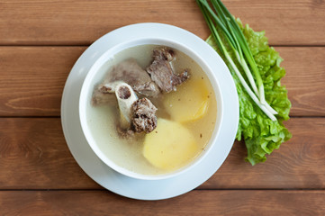 Soup with lamb meat and potato. Top view.