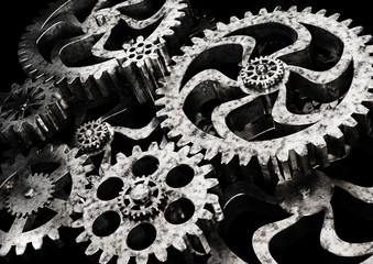 Gears wheels from rusty metal on black background. 3D illustration.