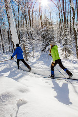 Couple cross country skiing in winter