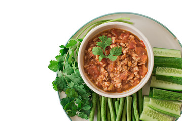 Thai Food ( Nam prik ong bruschetta ) and Vegetable set in the plate. isolated on white background, selective focus (detailed close-up shot)