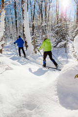 Couple cross country skiing in winter