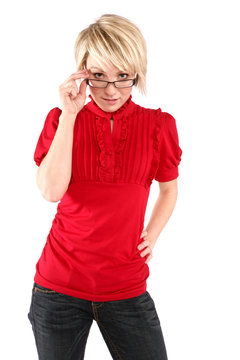 Woman with short blonde hair and a red blouse wearing glasses.