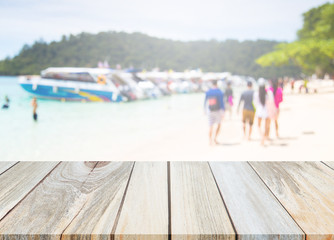Wood Table Top And Blur Background Of The Beach.