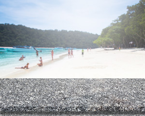 Obraz premium Marble Stone Table Top And Blur Background Of The Beach.