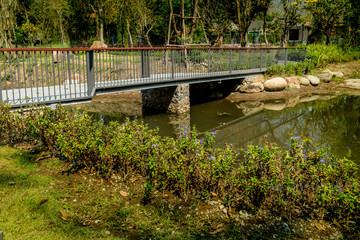 Concrete footbridge over the stream