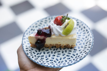 Close up of a part of cake in coffee shop.