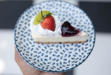 Close up of a part of cake in coffee shop.
