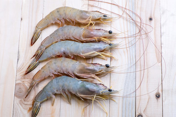 Fresh Whiteleg shrimp, pacific white shrimp on wooden