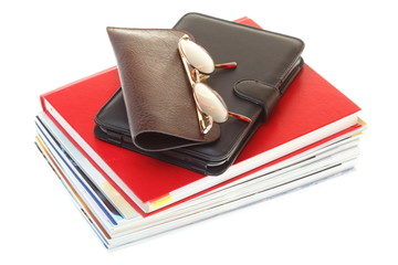 glasses eBook reader pile of books, isolated on white