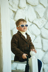 stylish portrait of a boy with glasses .Children's fashion