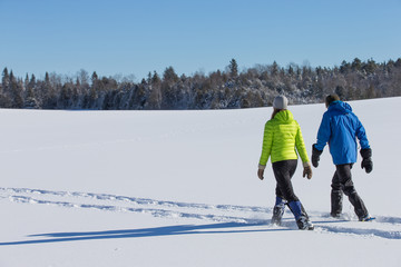 Couple Snowshoeing in fresh snow