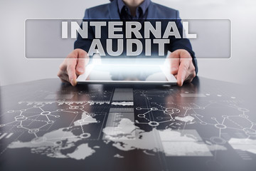 Businessman using tablet pc and selecting internal audit.