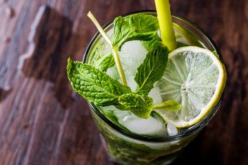 Mojito cocktail with lime, mint leaves and ice.
