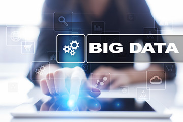 Woman using tablet pc, pressing on virtual screen and selecting big data.