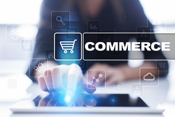 Woman using tablet pc, pressing on virtual screen and selecting commerce.