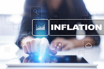 Fototapeta premium Woman using tablet pc, pressing on virtual screen and selecting inflation.