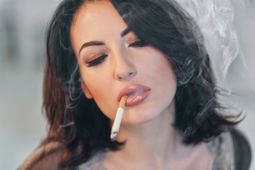 portrait of the young girl with the sexual person and a cigarette in a mouth