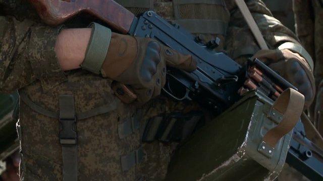 Close-up military pkm weapon on camouflage background