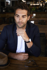 Handsome man in cafe, looking away