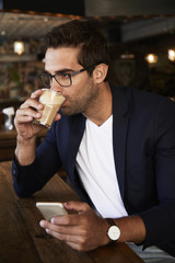 Coffee drinking guy in cafe