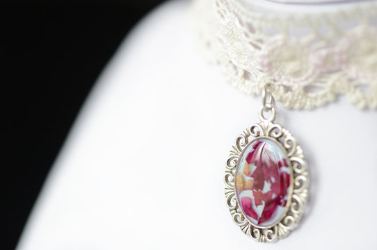 Lace choker with a pendant made of epoxy resin and rose petals