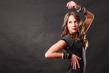 woman with jewellery in black evening dress