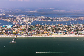Fishing Pier Fort Myers Beach. Aerial view to the large white sandy beach on the Estero Island, Florida