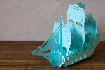 ship paper cur blue color on wood table