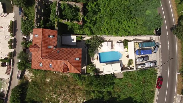 Villa with pool in the village of Ljuta. Montenegro, Bay of Kotor. Shooting from the air, aerial photography drone.