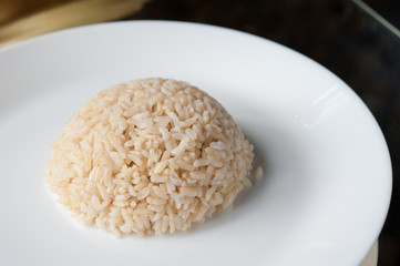 Thai jasmine cooked rice on white plate