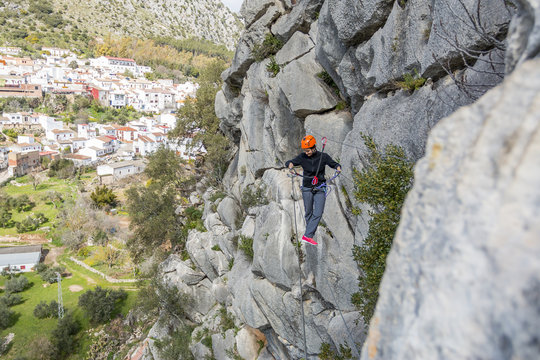 woman on tibetan bridge of a via ferrata