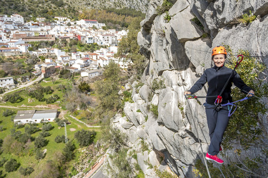 woman on tibetan bridge of a via ferrata