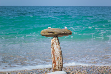 Symbol scales is made of stones of various shapes. Shallow depth of field.