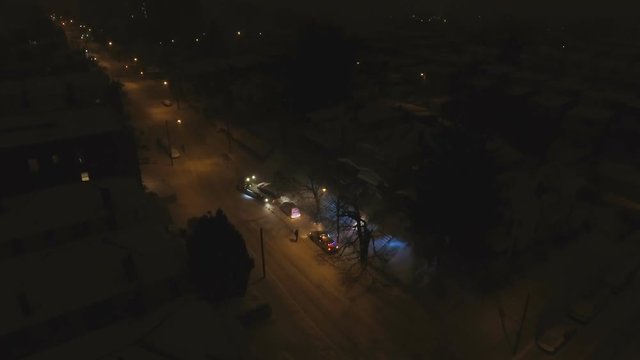 Tow truck taking car off snow emergency route