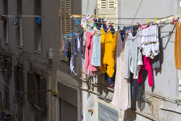Small Italian street with clothes hanging out to dry in Naples, Italy