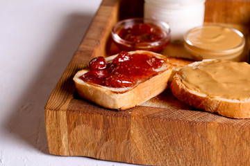 Bread toast with jelly jam and peanut butter. Sandwich for breakfast