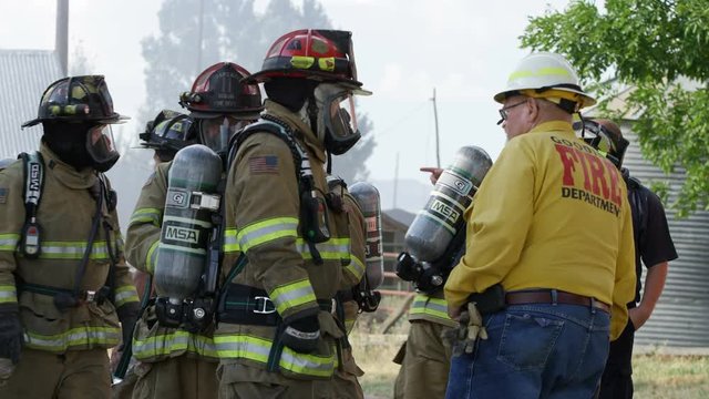 Firemen talking with each other