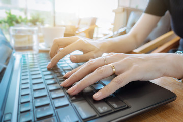 Hand on keyboard close up, business woman working on laptop in home office as agile technology concept