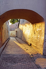 Arch and romantic sunset in old town in Vilnius
