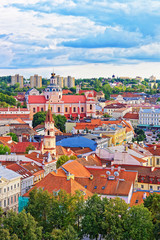 Obraz premium Roof tops of old town in Vilnius with churches towers