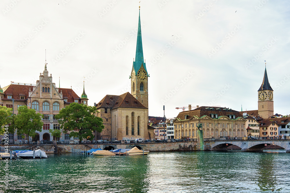 Wall mural fraumunster church and saint peter and boats at limmat zurich