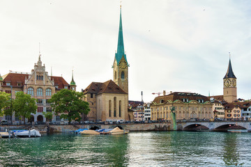 Fraumunster Church and Saint Peter and boats at Limmat Zurich