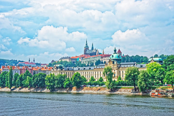 Vltava River embankment with Prague Old Town with Strakova Academy